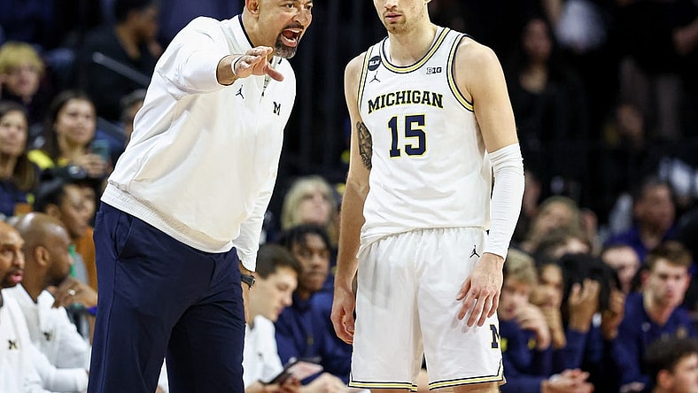 Feb 23, 2023; Piscataway, New Jersey, USA; Michigan Wolverines head coach Juwan Howard talks with guard Joey Baker (15) during the first half against the Rutgers Scarlet Knights at Jersey Mike's Arena. Mandatory Credit: Vincent Carchietta-USA TODAY Sports