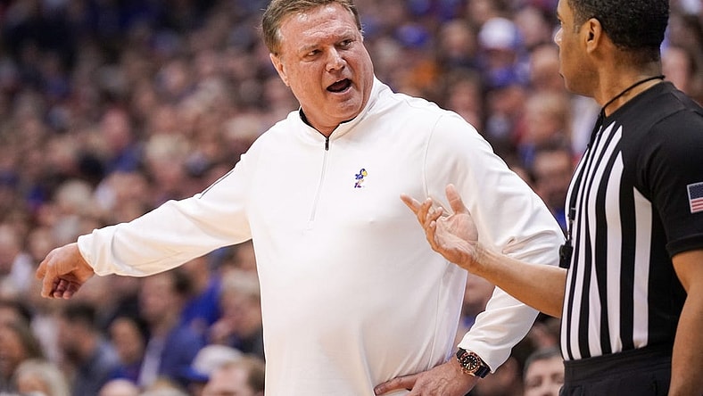 Feb 25, 2023; Lawrence, Kansas, USA; Kansas Jayhawks head coach Bill Self talks with an official against the West Virginia Mountaineers during the first half at Allen Fieldhouse. Mandatory Credit: Denny Medley-USA TODAY Sports