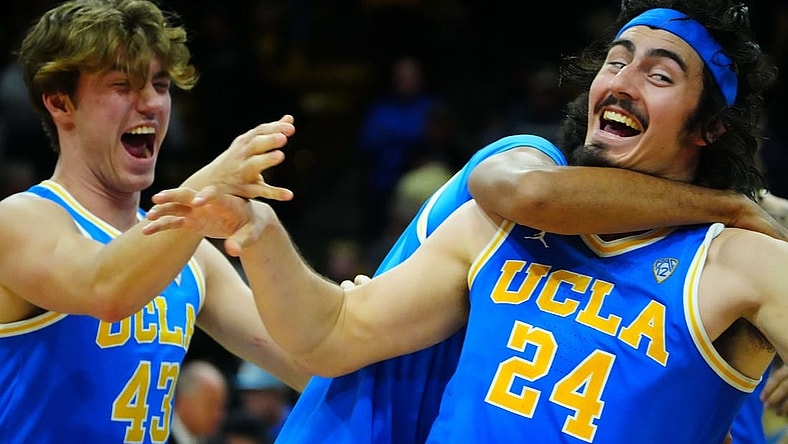 Feb 26, 2023; Boulder, Colorado, USA; UCLA Bruins guard Jaime Jaquez Jr. (24) and guard Russell Stong (43) celebrate defeating the Colorado Buffaloes at the CU Events Center. Mandatory Credit: Ron Chenoy-USA TODAY Sports