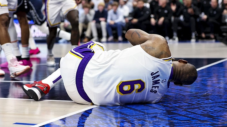 Feb 26, 2023; Dallas, Texas, USA; Los Angeles Lakers forward LeBron James (6) lays on the floor injured during the second half against the Dallas Mavericks at American Airlines Center. Mandatory Credit: Kevin Jairaj-USA TODAY Sports