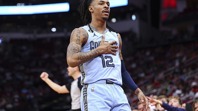 Mar 1, 2023; Houston, Texas, USA; Memphis Grizzlies guard Ja Morant (12) reacts after scoring a basket during the first quarter against the Houston Rockets at Toyota Center. Mandatory Credit: Troy Taormina-USA TODAY Sports