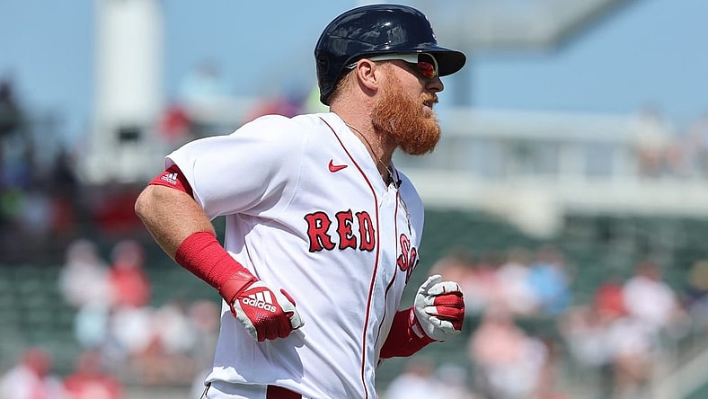 Mar 2, 2023; Fort Myers, Florida, USA; Boston Red Sox third baseman Justin Turner (2) singles during the first inning against the Philadelphia Phillies at JetBlue Park at Fenway South. Mandatory Credit: Kim Klement-USA TODAY Sports