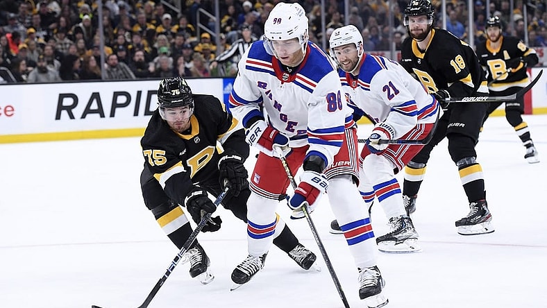 Mar 4, 2023; Boston, Massachusetts, USA; New York Rangers right wing Patrick Kane (88) controls the puck ahead of Boston Bruins defenseman Connor Clifton (75) during the second period at TD Garden. Mandatory Credit: Bob DeChiara-USA TODAY Sports