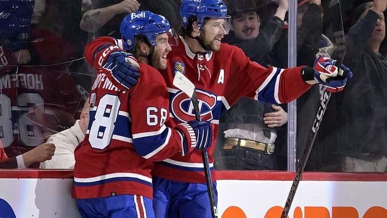 Mar 7, 2023; Montreal, Quebec, CAN; Montreal Canadiens forward Mike Hoffman (68) celebrates with teammate forward Josh Anderson (17) after scoring a goal against the Carolina Hurricanes during the first period at the Bell Centre. Mandatory Credit: Eric Bolte-USA TODAY Sports