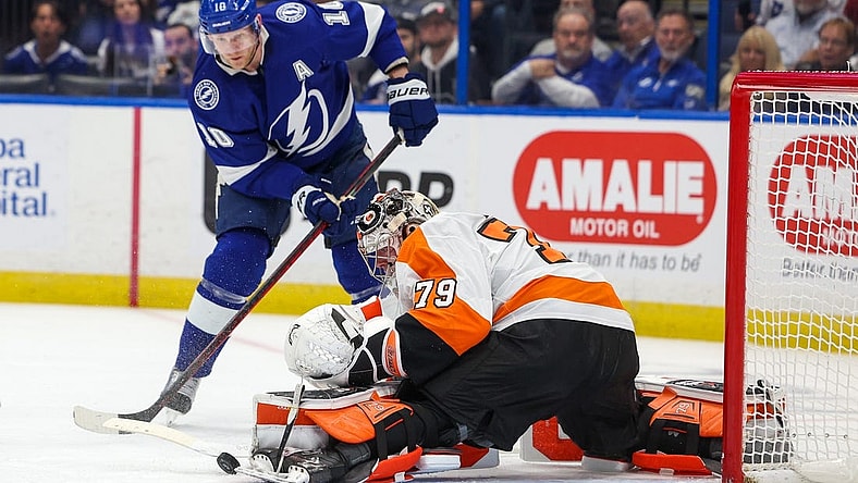 Mar 7, 2023; Tampa, Florida, USA;  Tampa Bay Lightning right wing Corey Perry (10) shoots the puck on Philadelphia Flyers goaltender Carter Hart (79) in the first period at Amalie Arena. Mandatory Credit: Nathan Ray Seebeck-USA TODAY Sports