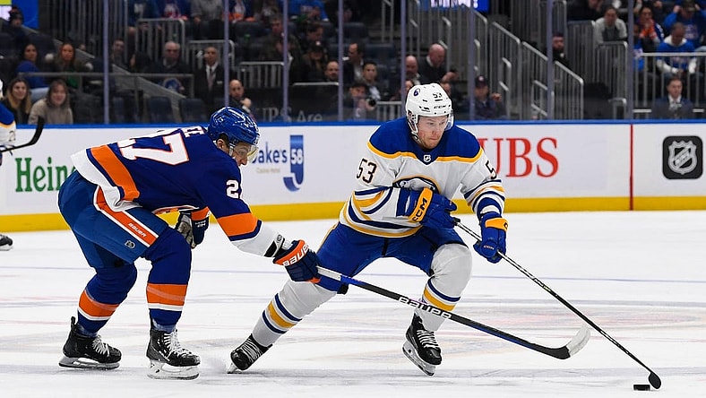 Mar 7, 2023; Elmont, New York, USA;  Buffalo Sabres left wing Jeff Skinner (53) skates with the puck defended by New York Islanders left wing Anders Lee (27) during the first period at UBS Arena. Mandatory Credit: Dennis Schneidler-USA TODAY Sports
