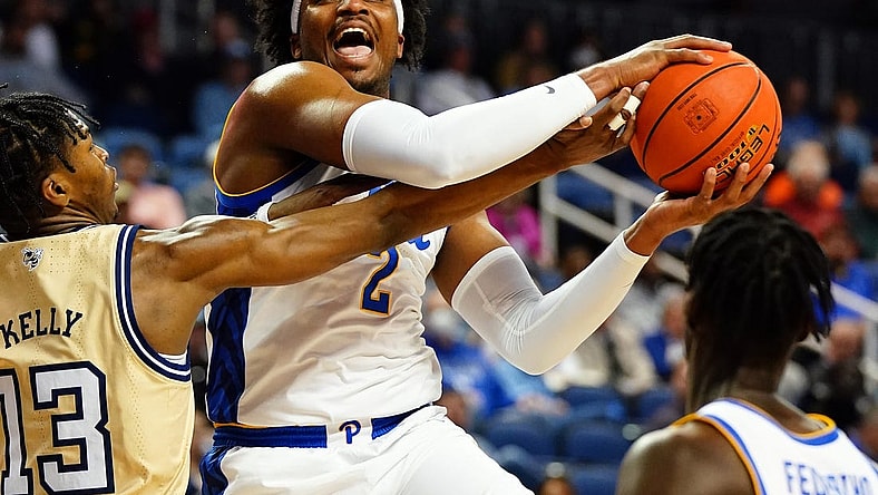 Mar 8, 2023; Greensboro, NC, USA; Pittsburgh Panthers forward Blake Hinson (2) drives to the basket against Georgia Tech Yellow Jackets guard Miles Kelly (13)  during the first half of the second round of the ACC tournament at Greensboro Coliseum. Mandatory Credit: John David Mercer-USA TODAY Sports