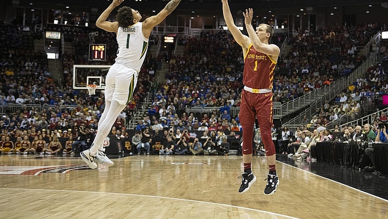 Mar 9, 2023; Kansas City, MO, USA; Iowa State Cyclones guard Eli King (1) shoots against Baylor Bears guard Keyonte George (1) in the first half at T-Mobile Center. Mandatory Credit: Amy Kontras-USA TODAY Sports