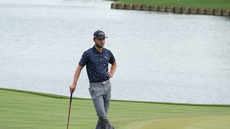 Mar 10, 2023; Ponte Vedra Beach, Florida, USA; Adam Svensson waits on the 18th green during the second round of THE PLAYERS Championship golf tournament. Mandatory Credit: David Yeazell-USA TODAY Sports