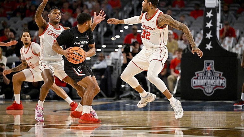 Mar 11, 2023; Fort Worth, TX, USA; Houston Cougars guard Marcus Sasser (0) and forward Reggie Chaney (32) defend against Cincinnati Bearcats guard David DeJulius (5) during the first half at Dickies Arena. Mandatory Credit: Jerome Miron-USA TODAY Sports
