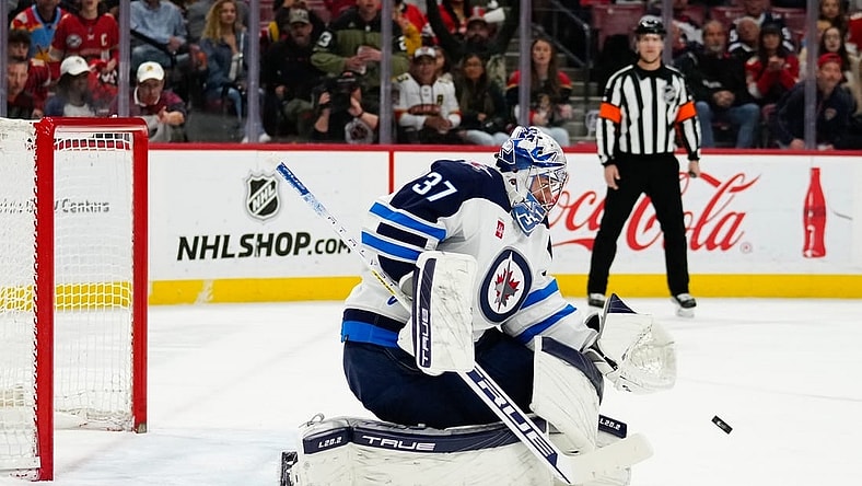 Mar 11, 2023; Sunrise, Florida, USA; Winnipeg Jets goaltender Connor Hellebuyck (37) makes a save against the Florida Panthers during the second period at FLA Live Arena. Mandatory Credit: Rich Storry-USA TODAY Sports