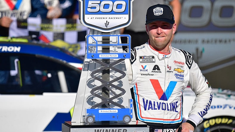 Mar 12, 2023; Avondale, Arizona, USA; NASCAR Cup Series driver William Byron (24) celebrates his victory of the United Rentals Work United 500 at Phoenix Raceway. Mandatory Credit: Gary A. Vasquez-USA TODAY Sports