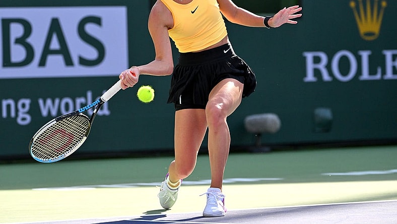 Mar 12, 2023; Indian Wells, CA, USA;    Anastasia Potapova (RUS) hits a shot in her fourth round match against Jessica Pegula (USA) in the BNP Paribas Open at the Indian Wells Tennis Garden. Mandatory Credit: Jayne Kamin-Oncea-USA TODAY Sports