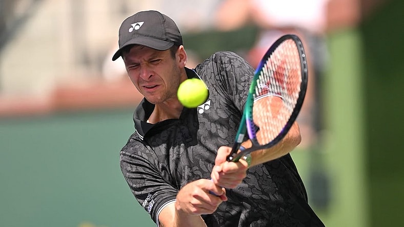 Mar 13, 2023; Indian Wells, CA, USA;  Hubert Hurkacz (POL) hits a shot in his fourth round match against Tommy Paul (USA) during the BNP Paribas Open at the Indian Wells Tennis Garden. Mandatory Credit: Jayne Kamin-Oncea-USA TODAY Sports