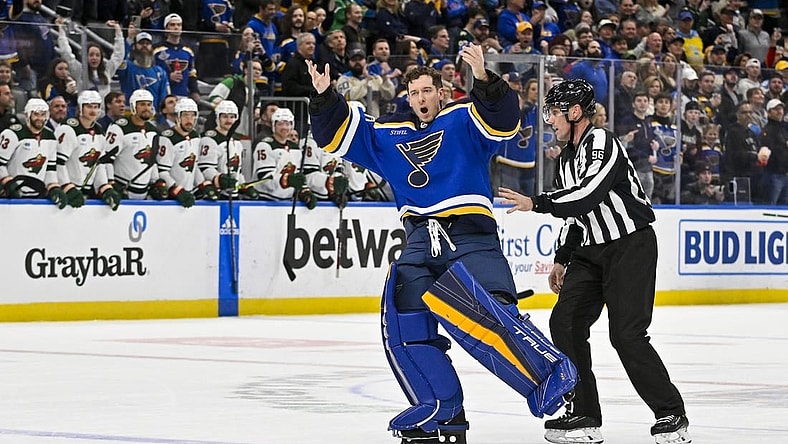 Mar 15, 2023; St. Louis, Missouri, USA;  St. Louis Blues goaltender Jordan Binnington (50) hypes up the crowd after he was ejected from the game during the second period against the Minnesota Wild at Enterprise Center. Mandatory Credit: Jeff Curry-USA TODAY Sports