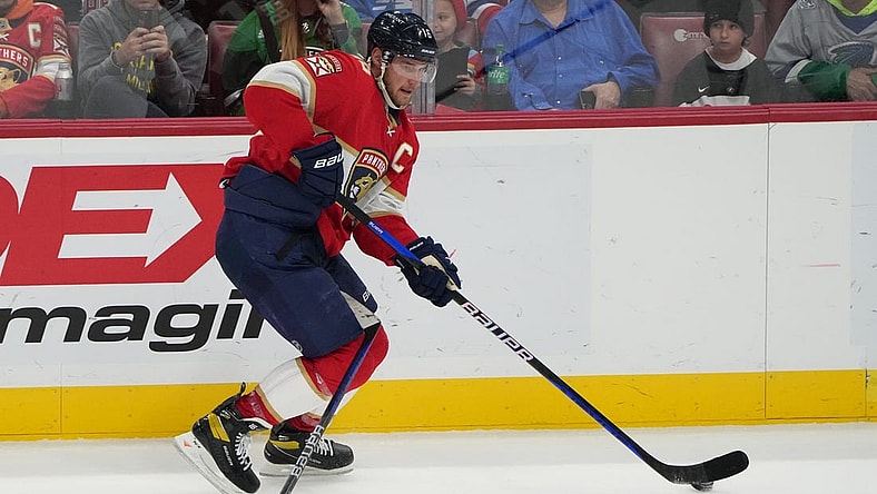Mar 16, 2023; Sunrise, Florida, USA; Florida Panthers center Aleksander Barkov (16) skates up the ice while  tangled up with a stick in the second period during the game against the Montreal Canadiens at FLA Live Arena. Mandatory Credit: Jim Rassol-USA TODAY Sports