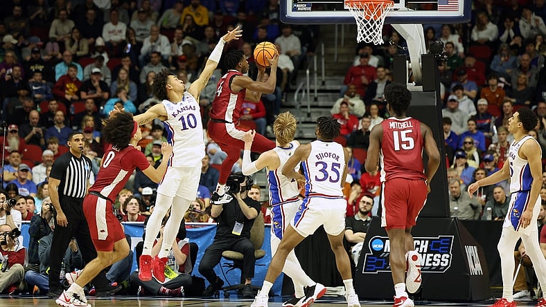 Mar 18, 2023; Des Moines, IA, USA; Arkansas Razorbacks guard Davonte Davis (4) shoots the ball against Kansas Jayhawks forward Jalen Wilson (10) during the second half at Wells Fargo Arena. Mandatory Credit: Reese Strickland-USA TODAY Sports