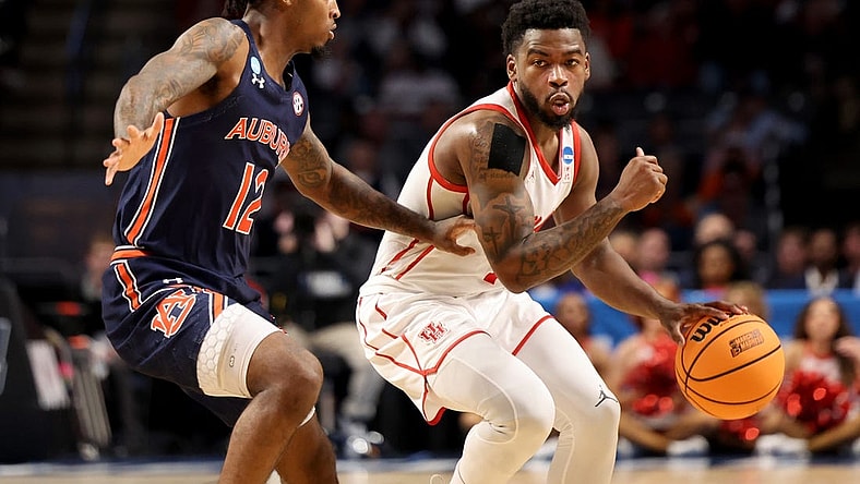 Mar 18, 2023; Birmingham, AL, USA; Houston Cougars guard Jamal Shead (1) dribbles against Auburn Tigers guard Zep Jasper (12) during the first half at Legacy Arena. Mandatory Credit: Vasha Hunt-USA TODAY Sports