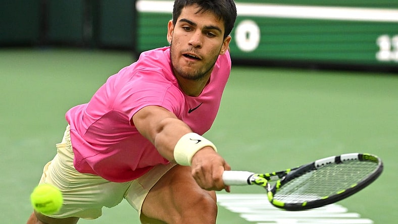 Mar 18, 2023; Indian Wells, CA, USA; Carlos Alcaraz (ESP) hits a shot in the semi final match defeating Jannik Sinner (ITA) in the BNP Paribas Open at the Indian Wells Tennis Garden. Mandatory Credit: Jayne Kamin-Oncea-USA TODAY Sports