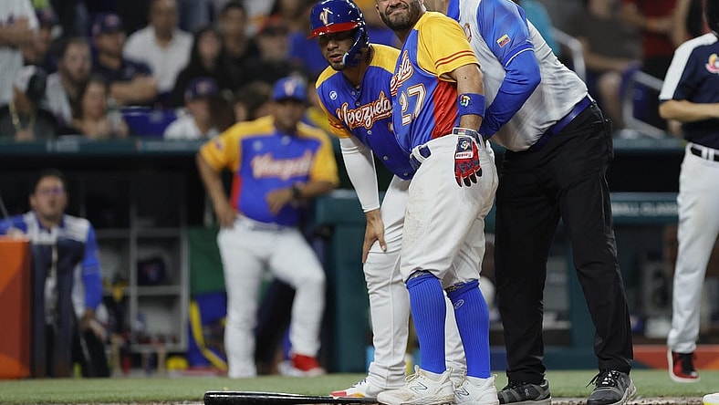 Mar 18, 2023; Miami, Florida, USA; Venezuela second baseman Jose Altuve (27) reacts after getting hit by a pitch during the fifth inning against the USA at LoanDepot Park. Mandatory Credit: Sam Navarro-USA TODAY Sports