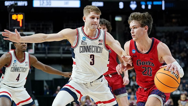 Mar 19, 2023; Albany, NY, USA; St. Mary s Gaels guard Aidan Mahaney (20) dribbles the ball against UConn Huskies guard Joey Calcaterra (3) during the first half at MVP Arena. Mandatory Credit: David Butler II-USA TODAY Sports