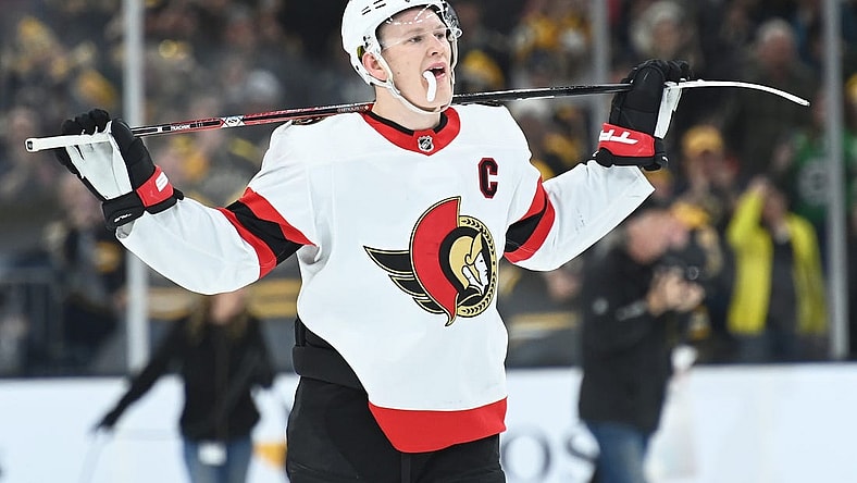 Mar 21, 2023; Boston, Massachusetts, USA; Ottawa Senators left wing Brady Tkachuk (7) skates off the ice after losing to the Boston Bruins at TD Garden. Mandatory Credit: Bob DeChiara-USA TODAY Sports