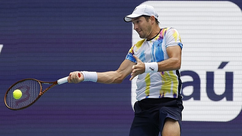 Mar 22, 2023; Miami, Florida, US; Dusan Lajovic (SRB) hits a forehand against Andy Murray (GBR) (not pictured) on day three of the Miami Open at Hard Rock Stadium. Mandatory Credit: Geoff Burke-USA TODAY Sports