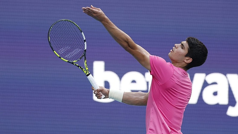 Mar 24, 2023; Miami, Florida, US; Carlos Alcaraz (ESP) serves against Facundo Bagnis (ARG) (not pictured) on day five of the Miami Open at Hard Rock Stadium. Mandatory Credit: Geoff Burke-USA TODAY Sports