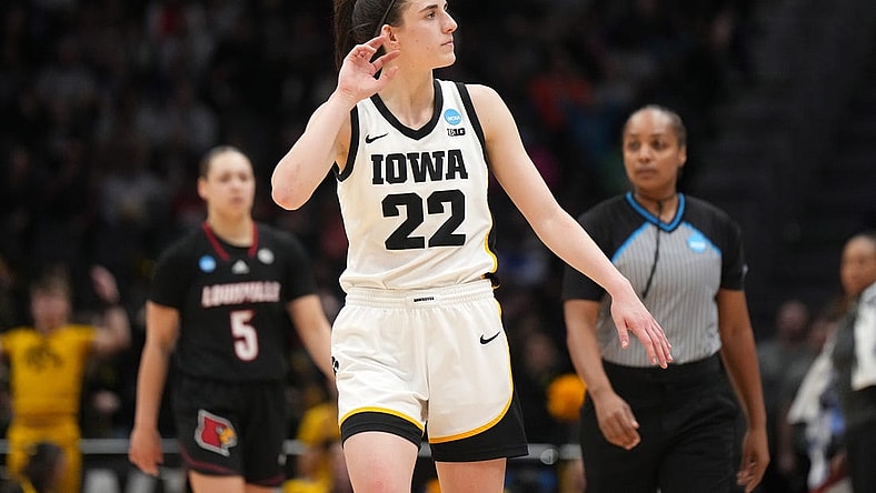 Mar 26, 2023; Seattle, WA, USA; Iowa Hawkeyes guard Caitlin Clark (22) reacts against the Louisville Cardinals in the second half at Climate Pledge Arena. Mandatory Credit: Kirby Lee-USA TODAY Sports