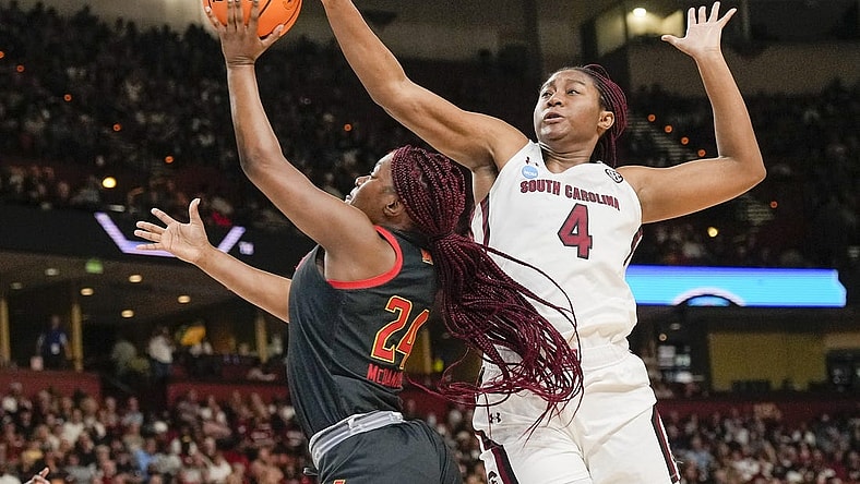 Mar 27, 2023; Greenville, SC, USA; South Carolina Gamecocks forward Aliyah Boston (4) blocks a shot by Maryland Terrapins guard Bri McDaniel (24) during the first half at the NCAA Women   s Tournament at Bon Secours Wellness Arena. Mandatory Credit: Jim Dedmon-USA TODAY Sports