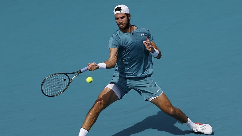 Mar 28, 2023; Miami, Florida, US; Karen Khachanov hits a forehand against Stefanos Tsitsipas (GRE) (not pictured) on day nine of the Miami Open at Hard Rock Stadium. Mandatory Credit: Geoff Burke-USA TODAY Sports