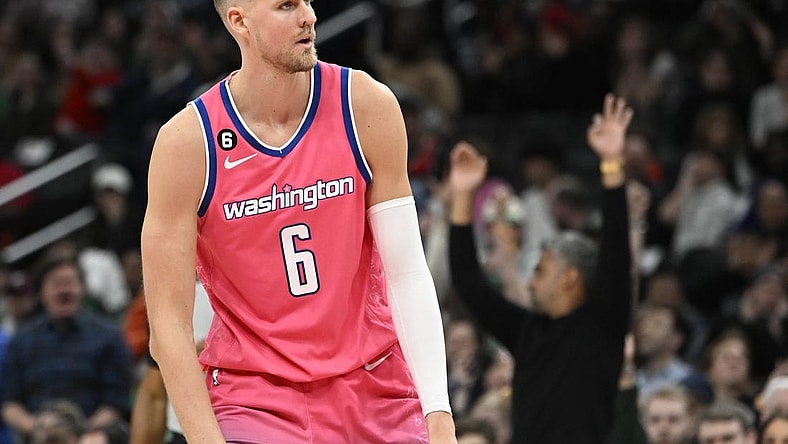 Mar 28, 2023; Washington, District of Columbia, USA; Washington Wizards center Kristaps Porzingis (6) reacts after a basket against the Boston Celtics during the second half at Capital One Arena. Mandatory Credit: Brad Mills-USA TODAY Sports