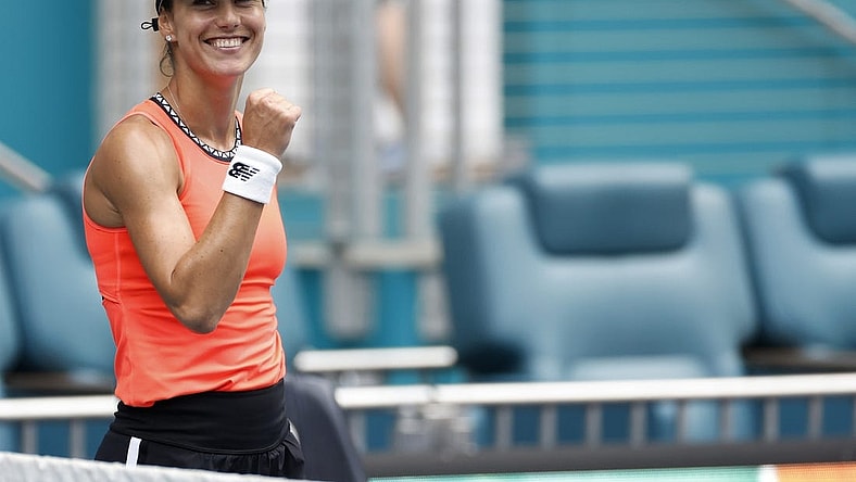 Mar 29, 2023; Miami, Florida, US; Sorana Cirstea (ROU)  celebrates after her match against Aryna Sabalenka (L) in a women's singles quarterfinal on day ten of the Miami Open at Hard Rock Stadium. Mandatory Credit: Geoff Burke-USA TODAY Sports