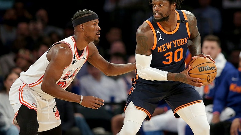 Mar 29, 2023; New York, New York, USA; New York Knicks forward Julius Randle (30) controls the ball against Miami Heat forward Jimmy Butler (22) during the first quarter at Madison Square Garden. Mandatory Credit: Brad Penner-USA TODAY Sports