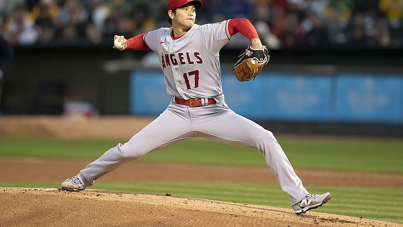 March 30, 2023; Oakland, California, USA; Los Angeles Angels starting pitcher Shohei Ohtani (17) delivers a pitch against the Oakland Athletics during the first inning at RingCentral Coliseum. Mandatory Credit: Kyle Terada-USA TODAY Sports