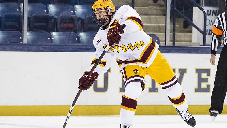 Mar 14, 2021; South Bend, Indiana, USA; Minnesota's Brock Faber (14) shoots against Michigan State at the Compton Family Ice Arena. Mandatory Credit: Michael Caterina/South Bend Tribune-USA TODAY NETWORK