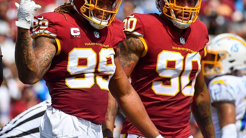 Sep 12, 2021; Landover, Maryland, USA; Washington Football Team defensive end Chase Young (99) and defensive end Montez Sweat (90) on the field against the Los Angeles Chargers during the first quarter at FedExField. Mandatory Credit: Brad Mills-USA TODAY Sports