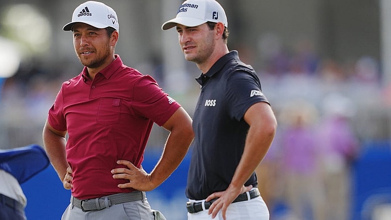 Apr 23, 2022; Avondale, Louisiana, USA; Xander Schauffele and Patrick Cantlay react after playing hole 18 during the third round of the Zurich Classic of New Orleans golf tournament. Mandatory Credit: Andrew Wevers-USA TODAY Sports