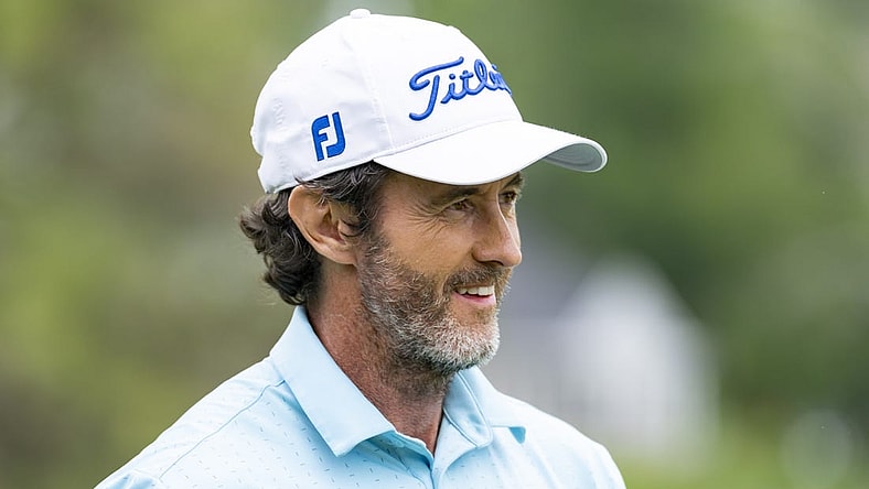 May 26, 2022; Benton Harbor, Michigan, USA; Mark Hensby smiles on the eighteenth green during the first round of the 2022 KitchenAid Senior PGA Championship at Harbor Shores. Mandatory Credit: Raj Mehta-USA TODAY Sports