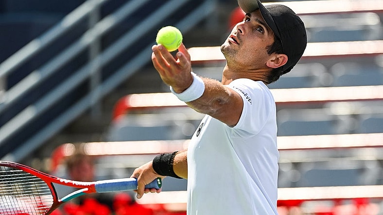 Aug 7, 2022; Montreal, Quebec, Canada; Marcos Giron (USA) serves the ball against Alexei Popyrin (AUS) (not pictured) in second round qualifying play at IGA Stadium. Mandatory Credit: David Kirouac-USA TODAY Sports