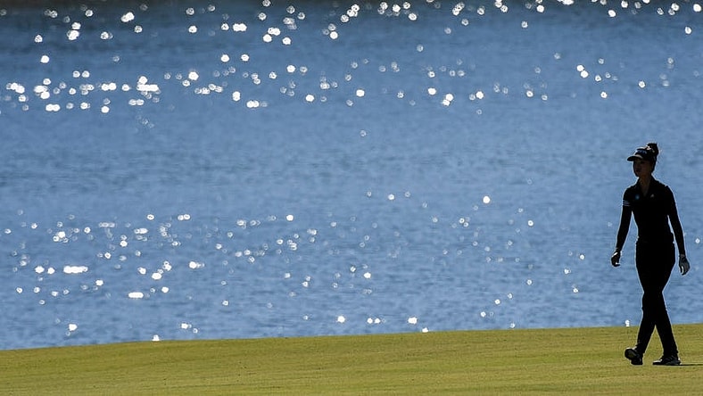 Sep 30, 2022; Tuscaloosa, AL, USA; Grace Kim walks beside the lake along the 18th fairway as she plays Friday, Sept. 30, 2022 at Ol' Colony Golf Complex during the first round of the Epson Tour event.
Golf Tuscaloosa Toyota Classic Epson Tour Event