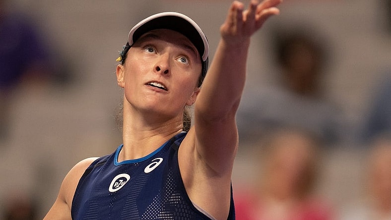 Nov 1, 2022; Forth Worth, TX, USA; Iga Swiatek (POL) tosses the ball to serve during her match against Daria Kasatkina on day two of the WTA Finals at Dickies Arena. Mandatory Credit: Susan Mullane-USA TODAY Sports