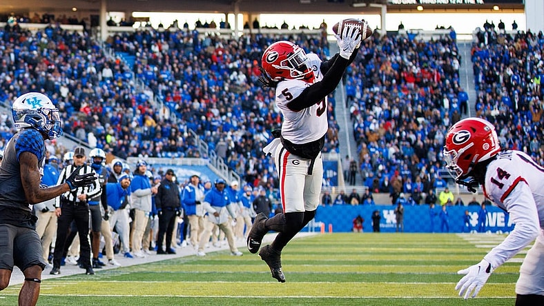 Nov 19, 2022; Lexington, Kentucky, USA; Georgia Bulldogs defensive back Kelee Ringo (5) intercepts a pass during the second quarter against the Kentucky Wildcats at Kroger Field. Mandatory Credit: Jordan Prather-USA TODAY Sports