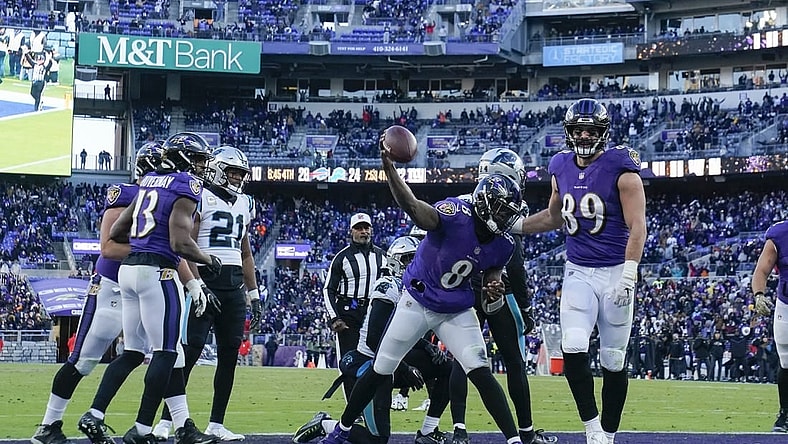 Nov 20, 2022; Baltimore, Maryland, USA;  Baltimore Ravens quarterback Lamar Jackson (8) spikes the ball after running for a touchdown against the Carolina Panthers during the second half at M&T Bank Stadium. Mandatory Credit: Jessica Rapfogel-USA TODAY Sports