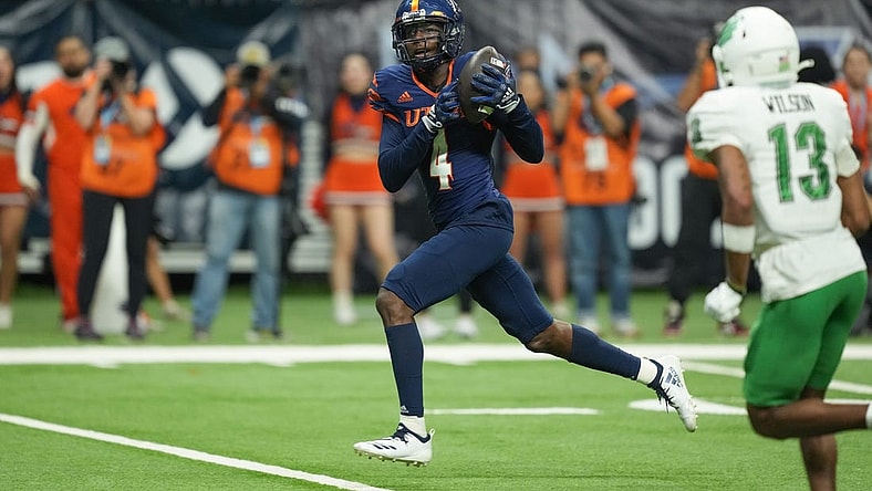 Dec 2, 2022; San Antonio, Texas, USA;  UTSA Roadrunners wide receiver Zakhari Franklin (4) catches a touchdown in the second half against the North Texas Mean Green at the Alamodome. Mandatory Credit: Daniel Dunn-USA TODAY Sports