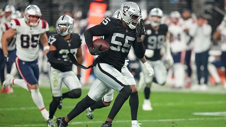 Dec 18, 2022; Paradise, Nevada, USA; Las Vegas Raiders defensive end Chandler Jones (55) returns an interception for a touchdown against the New England Patriots at the end of the second half to give the Raiders a 30-24 victory at Allegiant Stadium. Mandatory Credit: Stephen R. Sylvanie-USA TODAY Sports