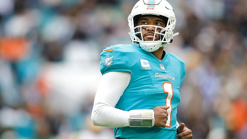 Dec 25, 2022; Miami Gardens, Florida, USA; Miami Dolphins quarterback Tua Tagovailoa (1) looks on from the field during the second quarter against the Green Bay Packers at Hard Rock Stadium. Mandatory Credit: Sam Navarro-USA TODAY Sports