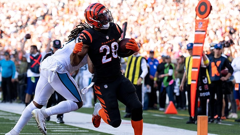 Cincinnati Bengals running back Joe Mixon (28) scores his fifth touchdown as Carolina Panthers linebacker Shaq Thompson (7) attempts to stop him in the third quarter during a Week 9 NFL game, Sunday, Nov. 6, 2022, at Paycor Stadium in Cincinnati. Cincinnati Bengals running back Joe Mixon (28) scored a franchise record five touchdowns in the game.

Nfl Carolina Panthers At Cincinnati Bengals