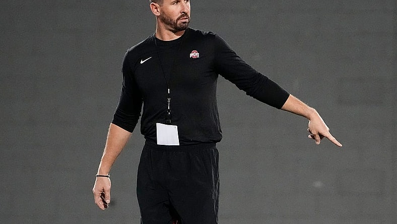Mar 7, 2023; Columbus, Ohio, USA;  Ohio State Buckeyes offensive coordinator Brian Hartline motions during spring football drills at the Woody Hayes Athletic Center. Mandatory Credit: Adam Cairns-The Columbus Dispatch

Football Ohio State Buckeyes Football