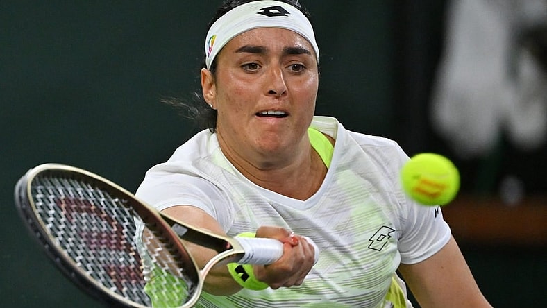 Mar 11, 2023; Indian Wells, CA, USA;  Ons Jabeur (TUN) hits a shot during her second round match against Magdalena Frech (POL) in the BNP Paribas Open at the Indian Wells Tennis Garden. Mandatory Credit: Jayne Kamin-Oncea-USA TODAY Sports